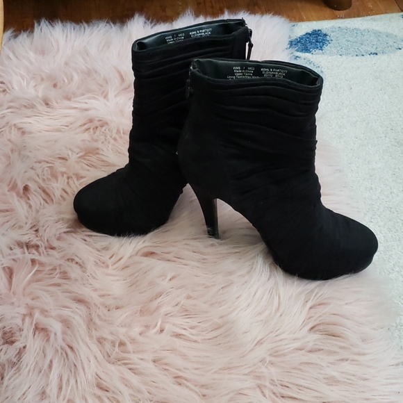 A pair of black booties. - Picture 3 of 3